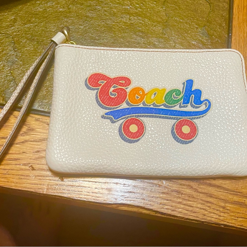 Rainbow Coach coin purse with skate